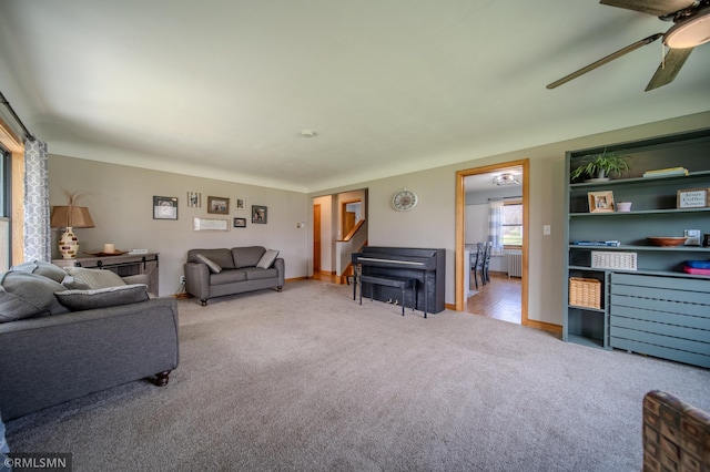 300 Carlson Rd, Cannon Falls, MN 55009 - living area featuring radiator, a ceiling fan, carpet floors, and baseboards