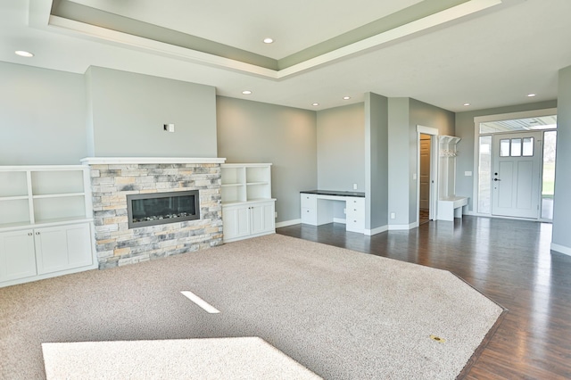 203 Walnut Hill Way, Troy Twp, WI 54022 - living area with baseboards, dark wood-type flooring, and a stone fireplace