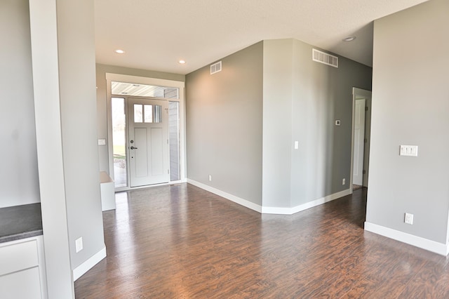 203 Walnut Hill Way, Troy Twp, WI 54022 - entrance foyer with baseboards, visible vents, and dark wood finished floors