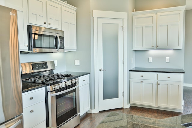 203 Walnut Hill Way, Troy Twp, WI 54022 - kitchen with dark wood finished floors, appliances with stainless steel finishes, and white cabinetry
