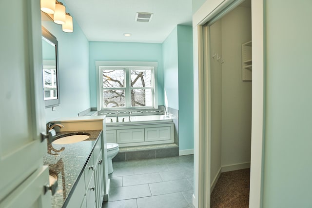 203 Walnut Hill Way, Troy Twp, WI 54022 - full bathroom with a garden tub, vanity, toilet, baseboards, and tile patterned floors
