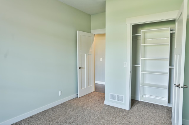 203 Walnut Hill Way, Troy Twp, WI 54022 - unfurnished bedroom with visible vents, baseboards, carpet floors, and a closet