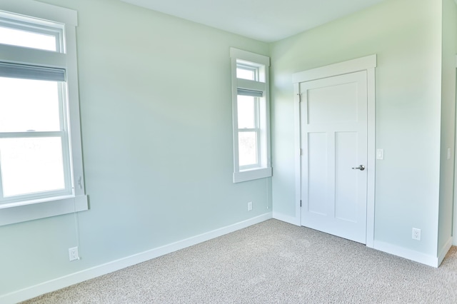 203 Walnut Hill Way, Troy Twp, WI 54022 - unfurnished bedroom featuring baseboards and carpet