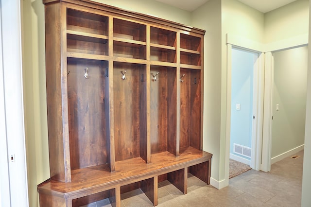 203 Walnut Hill Way, Troy Twp, WI 54022 - mudroom featuring visible vents, baseboards, and light tile patterned flooring