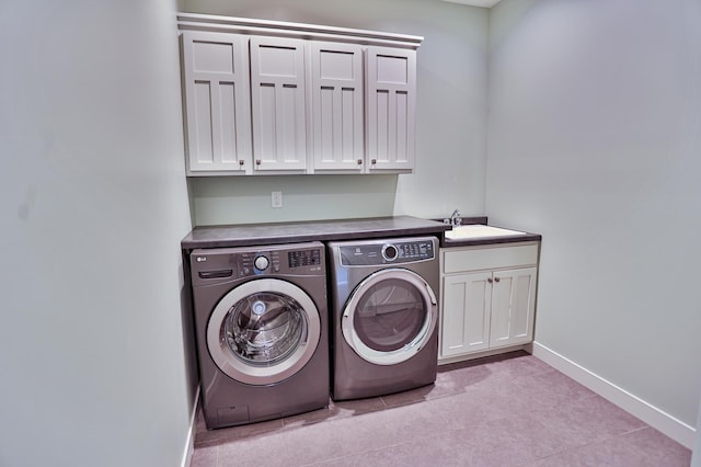 203 Walnut Hill Way, Troy Twp, WI 54022 - laundry room featuring cabinet space, washer and dryer, a sink, baseboards, and light tile patterned floors