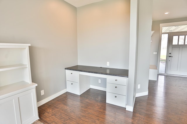 203 Walnut Hill Way, Troy Twp, WI 54022 - unfurnished office with baseboards, dark wood-style flooring, and built in desk