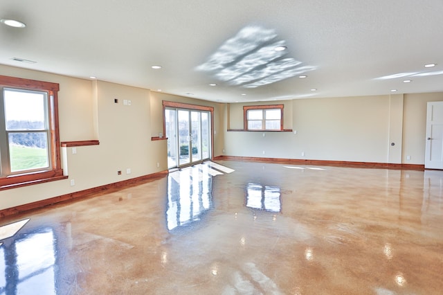 203 Walnut Hill Way, Troy Twp, WI 54022 - empty room featuring baseboards, recessed lighting, concrete flooring, and visible vents