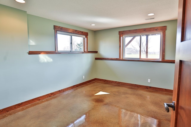 203 Walnut Hill Way, Troy Twp, WI 54022 - spare room featuring recessed lighting, baseboards, visible vents, and plenty of natural light
