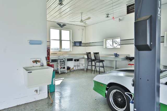 203 Walnut Hill Way, Troy Twp, WI 54022 - garage featuring ceiling fan and a sink