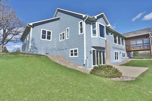 203 Walnut Hill Way, Troy Twp, WI 54022 - view of home's exterior featuring a lawn, a sunroom, and a patio area