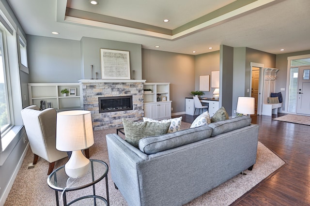 203 Walnut Hill Way, Troy Twp, WI 54022 - living area with wood finished floors, a fireplace, recessed lighting, and a tray ceiling