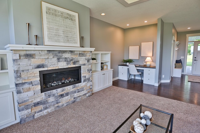 203 Walnut Hill Way, Troy Twp, WI 54022 - living room featuring dark carpet, an office area, a stone fireplace, and recessed lighting