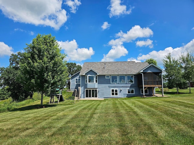 203 Walnut Hill Way, Troy Twp, WI 54022 - back of house featuring a sunroom and a lawn