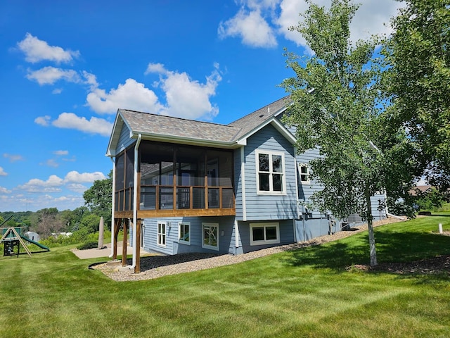 203 Walnut Hill Way, Troy Twp, WI 54022 - rear view of property featuring a sunroom, a lawn, a patio area, and a shingled roof