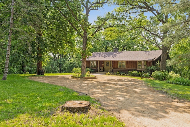 1433 Oldridge Ave N, West Lakeland Twp, MN 55082 - single story home featuring dirt driveway, a front yard, a chimney, and covered porch