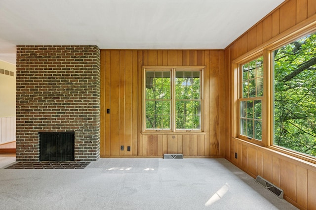 1433 Oldridge Ave N, West Lakeland Twp, MN 55082 - unfurnished living room with healthy amount of natural light, wooden walls, and carpet