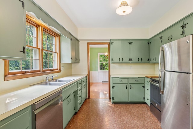 1433 Oldridge Ave N, West Lakeland Twp, MN 55082 - kitchen with stainless steel appliances, a sink, plenty of natural light, and light countertops