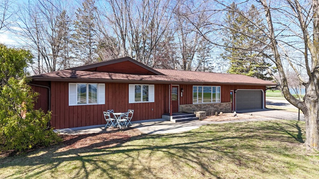651 Broadway Ave N, Foley, MN 56329 - single story home with a front lawn, driveway, and a garage