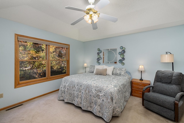 bedroom featuring light colored carpet, ceiling fan, baseboards, and visible vents