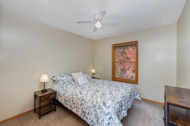 bedroom featuring a ceiling fan, baseboards, and carpet floors