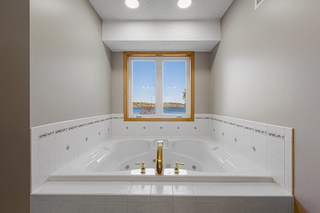 bathroom featuring a tub with jets