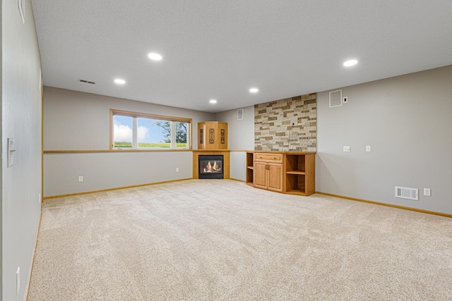 interior space featuring visible vents and carpet floors
