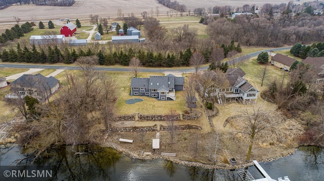 birds eye view of property featuring a rural view and a water view