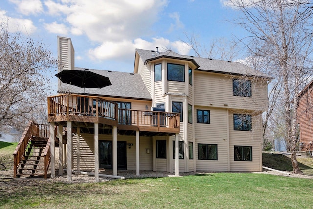 back of house with a shingled roof, stairway, a yard, a chimney, and a deck