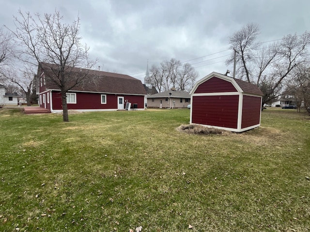 130 2nd St NE, Mcintosh, MN 56556 - view of yard featuring an outbuilding and a storage unit