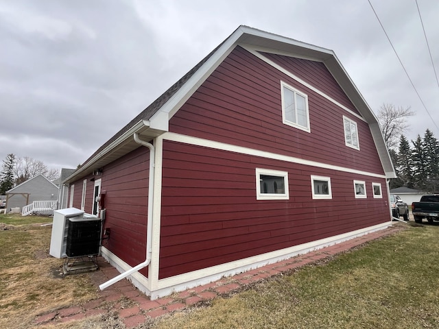130 2nd St NE, Mcintosh, MN 56556 - view of side of property with a lawn and ac unit