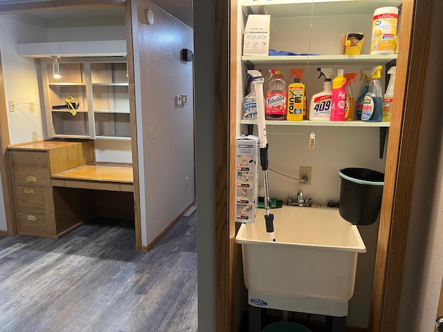 130 2nd St NE, Mcintosh, MN 56556 - bathroom featuring a sink, wood finished floors, and a soaking tub