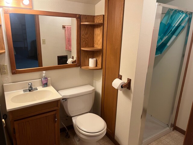 130 2nd St NE, Mcintosh, MN 56556 - bathroom featuring vanity, baseboards, a stall shower, and toilet
