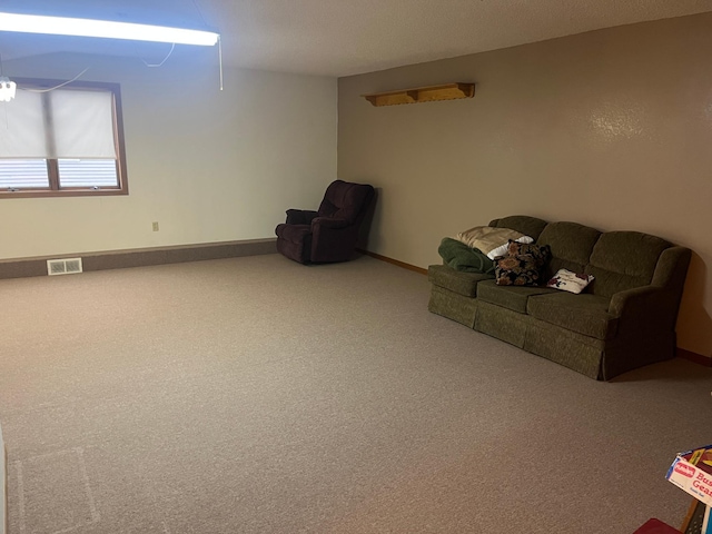 130 2nd St NE, Mcintosh, MN 56556 - carpeted living area featuring baseboards and visible vents