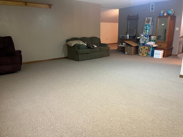 130 2nd St NE, Mcintosh, MN 56556 - carpeted living room featuring visible vents and baseboards