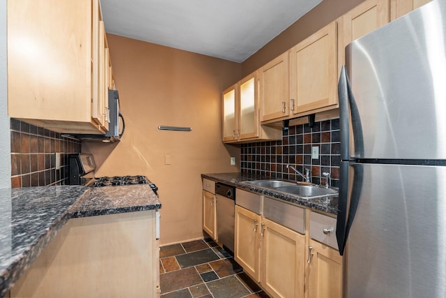 1820 1st Ave S Unit 102, Minneapolis, MN 55403 - kitchen with light brown cabinets, decorative backsplash, stone finish floor, appliances with stainless steel finishes, and a sink