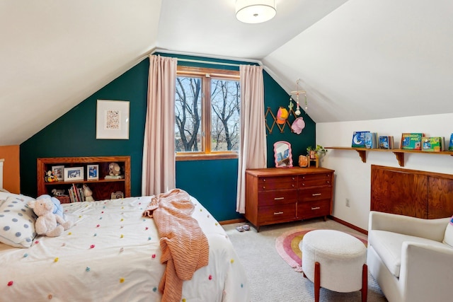 bedroom with baseboards, light colored carpet, and vaulted ceiling