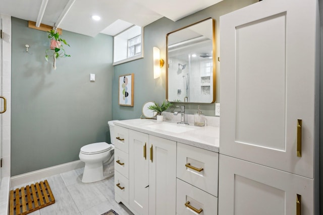 full bathroom featuring vanity, baseboards, a shower stall, and toilet