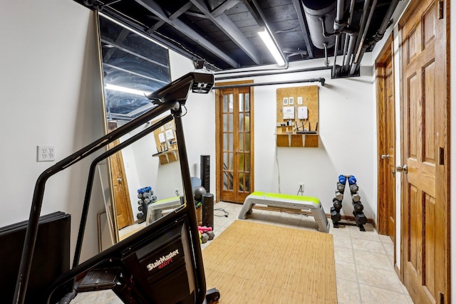 workout room with tile patterned floors