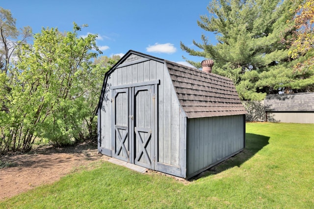 view of shed with fence