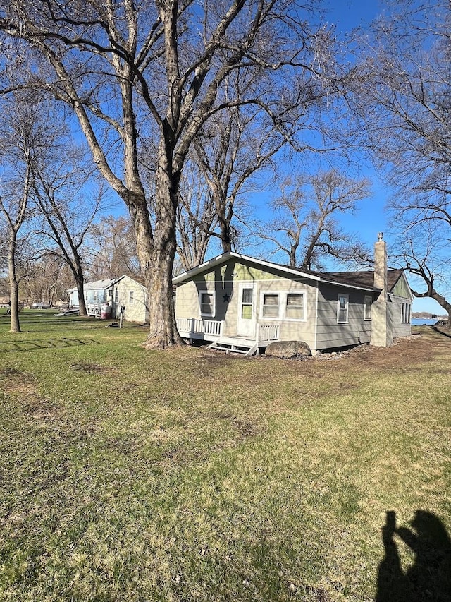 6870 159th St NE, Atwater, MN 56209 - view of front of home with a chimney and a front yard