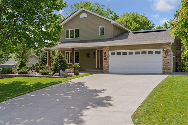 3861 Westbury Dr, Eagan, MN 55123 - traditional-style home with a front lawn, a garage, covered porch, roof mounted solar panels, and driveway