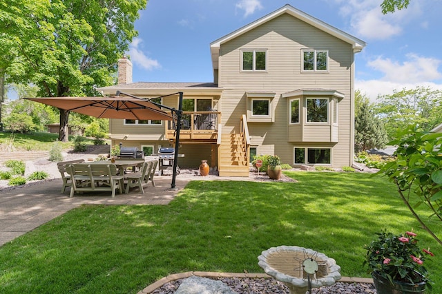 3861 Westbury Dr, Eagan, MN 55123 - rear view of house with a patio, stairway, a lawn, and a deck