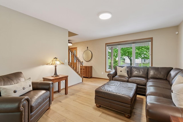 3861 Westbury Dr, Eagan, MN 55123 - living area featuring stairs, light wood-style flooring, and baseboards