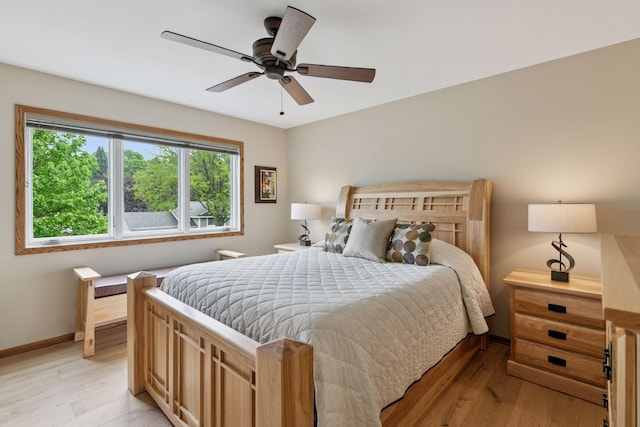 3861 Westbury Dr, Eagan, MN 55123 - bedroom featuring light wood-style floors, a ceiling fan, and baseboards