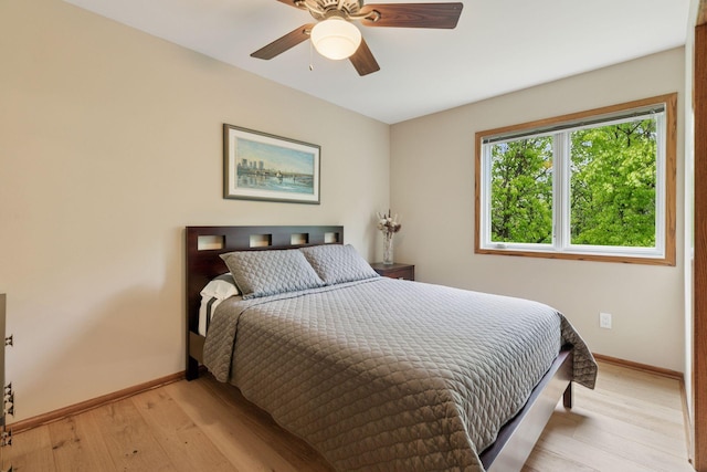 3861 Westbury Dr, Eagan, MN 55123 - bedroom featuring baseboards, light wood-style floors, and a ceiling fan