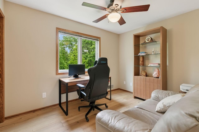 3861 Westbury Dr, Eagan, MN 55123 - office area featuring light wood-style floors, a ceiling fan, and baseboards