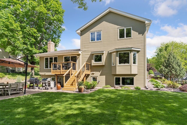 3861 Westbury Dr, Eagan, MN 55123 - back of property featuring a patio, a deck, a yard, stairs, and a chimney