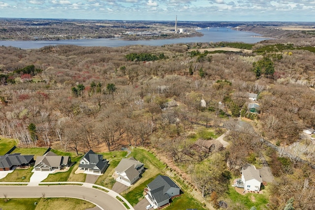 drone / aerial view featuring a residential view and a water view