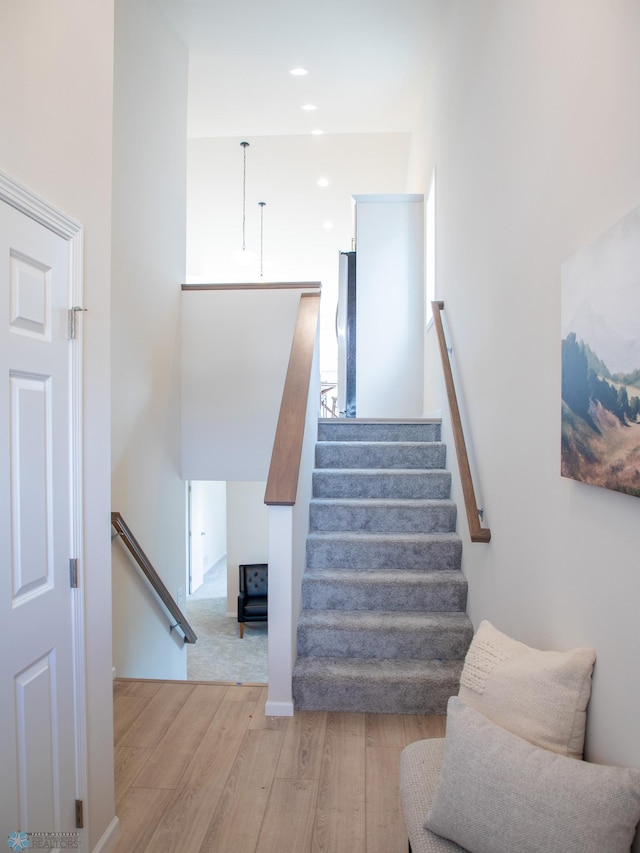 stairs with wood finished floors