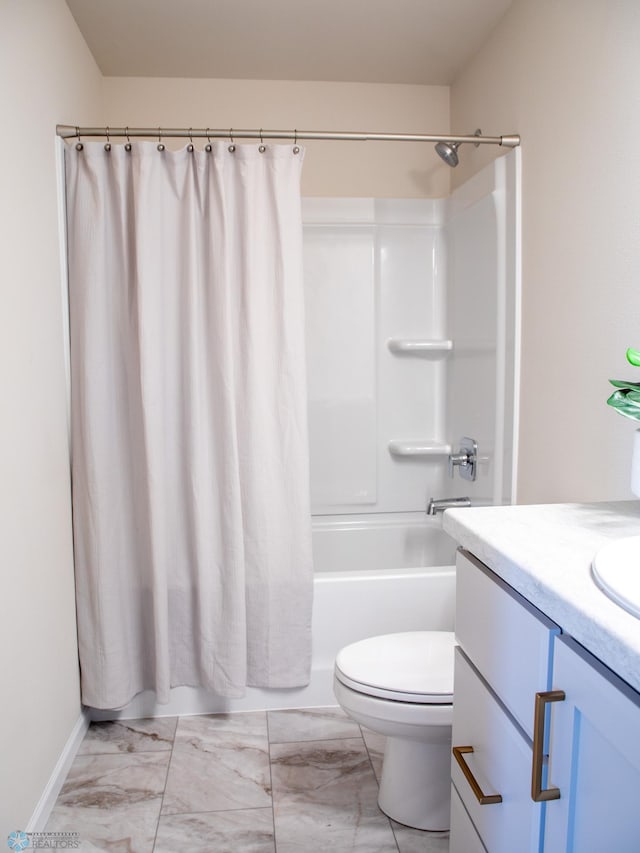 bathroom featuring vanity, toilet, shower / bath combination with curtain, marble finish floor, and baseboards